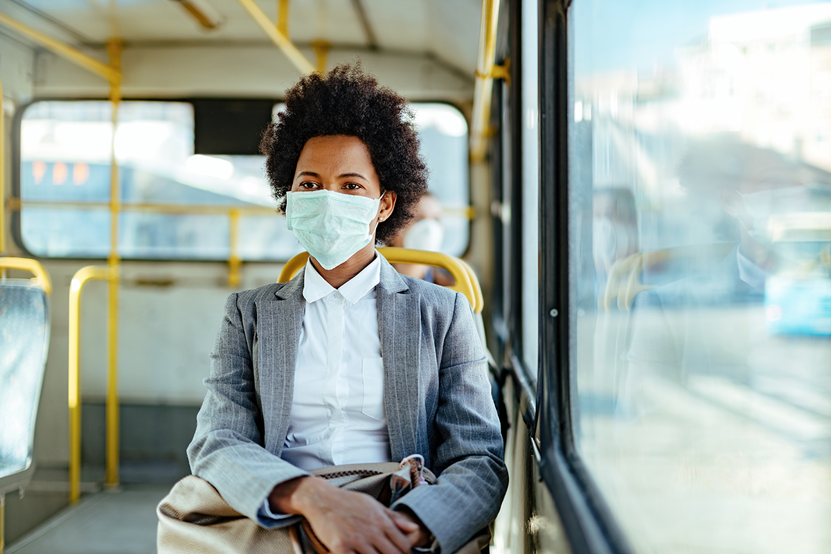 woman on bus with mask