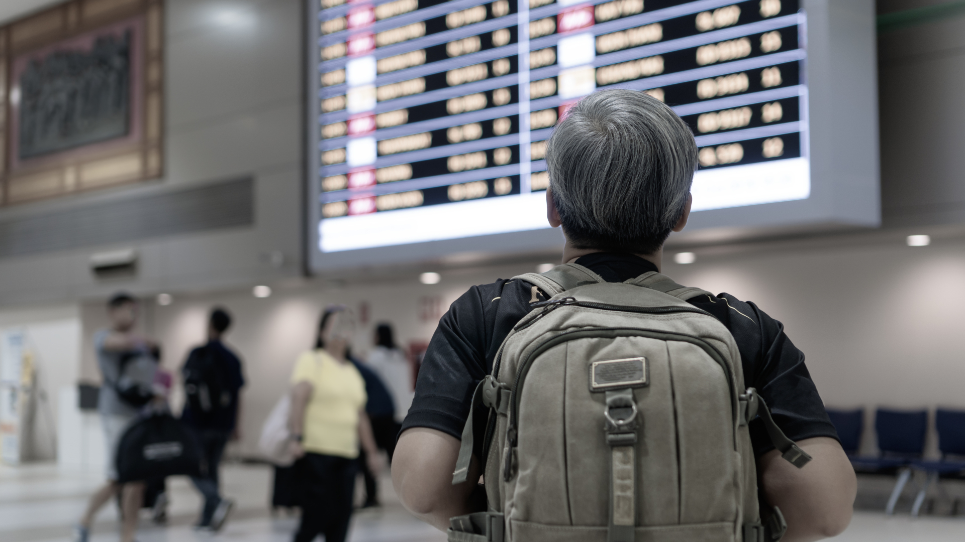 Man looking at schedule board